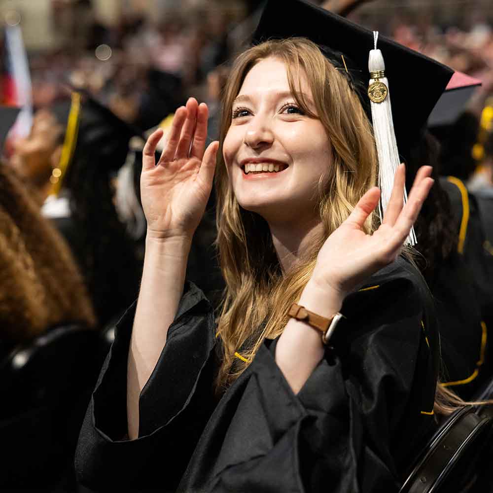 excited student at graduating at ksu.