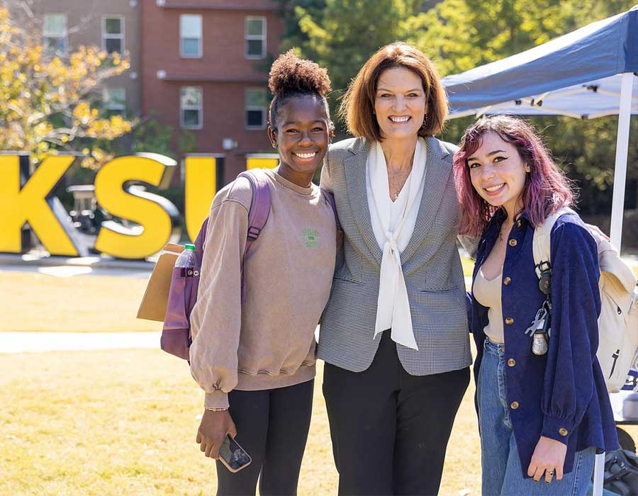 President Kat Schwaig with students on the marietta campus.