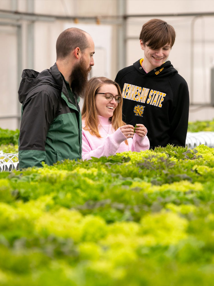 ksu students in the green house.