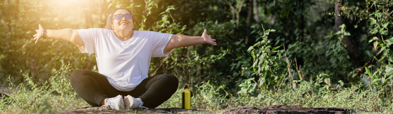 A woman stretching in an outdoor setting