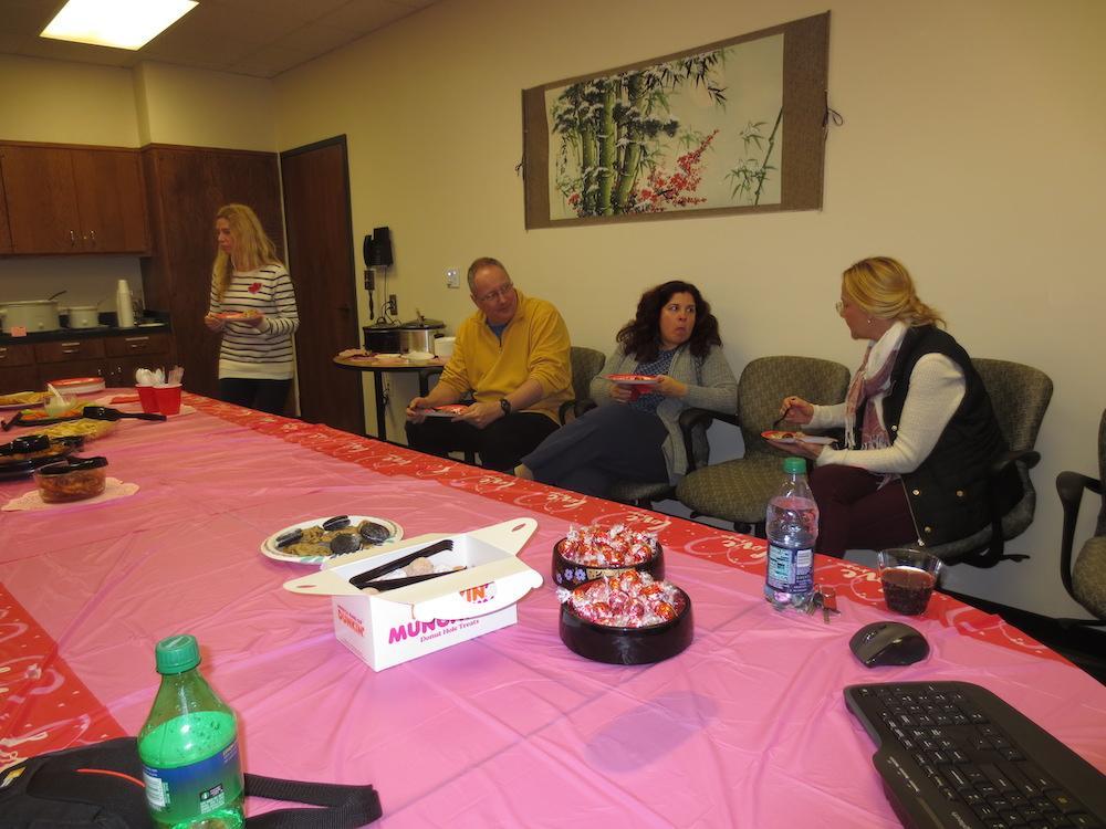  / people having cake in meeting room