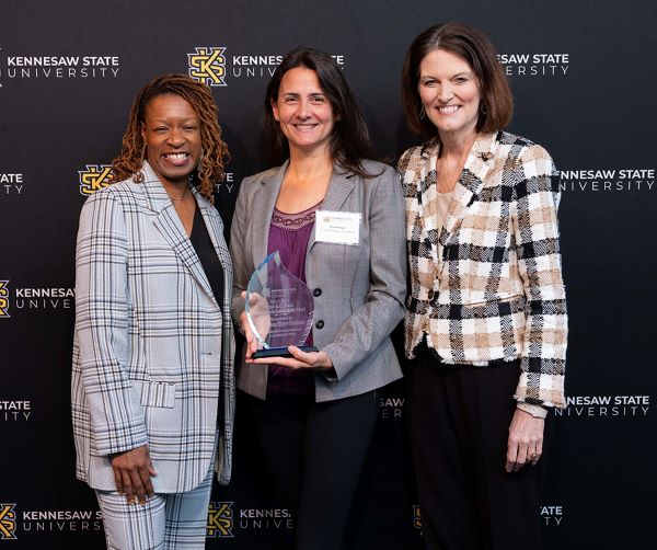 Dr. Vanessa Slinger-Friedman, receiving an award at KSU