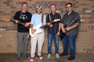 SGIA Band Realpolitik standing up against brick wall