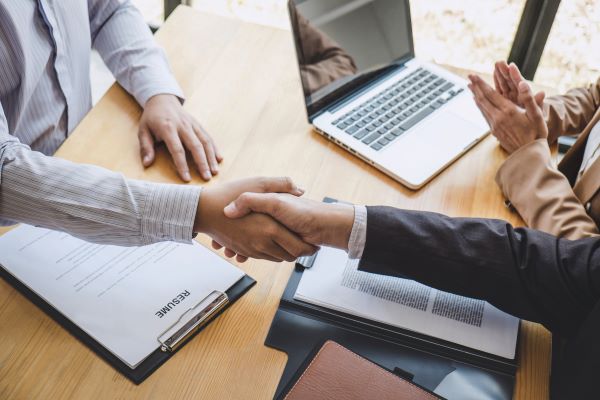 Candidate shaking hands with interviewer 