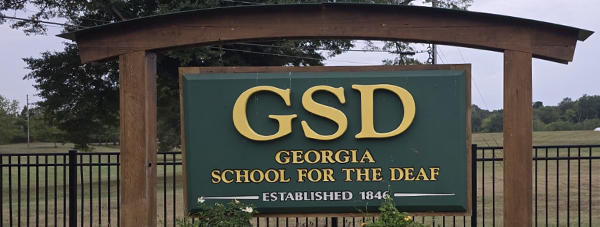 Exterior view of the Georgia School for the Deaf, showcasing the building and surrounding landscape.
