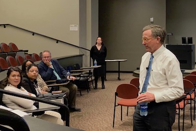 Gray McCalley (right) speaks with faculty and students about his intercultural journey