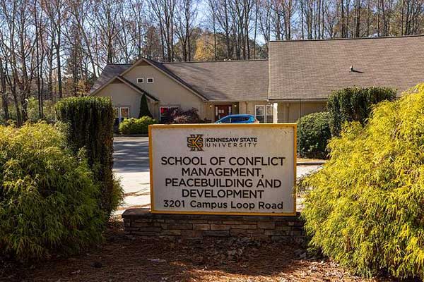 school of conflict management, peacebuilding and development sign on ksu campus