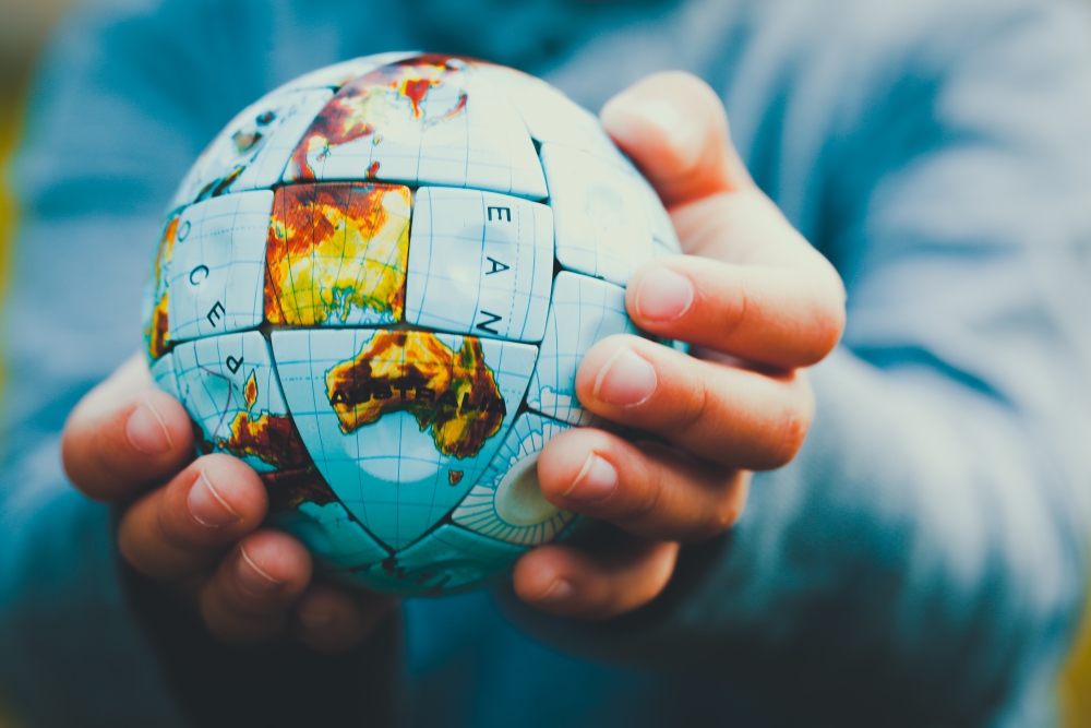 Hands Holding Globe