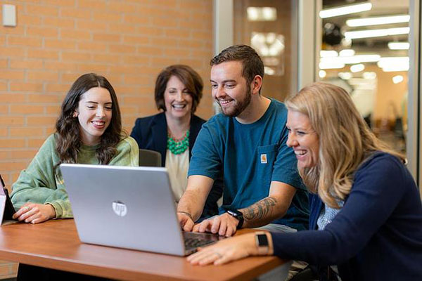 group of people in front of computer