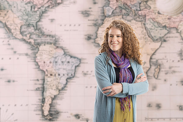 helen hobson standing in front of a map