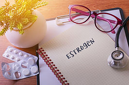 the word estrogen on a notepad