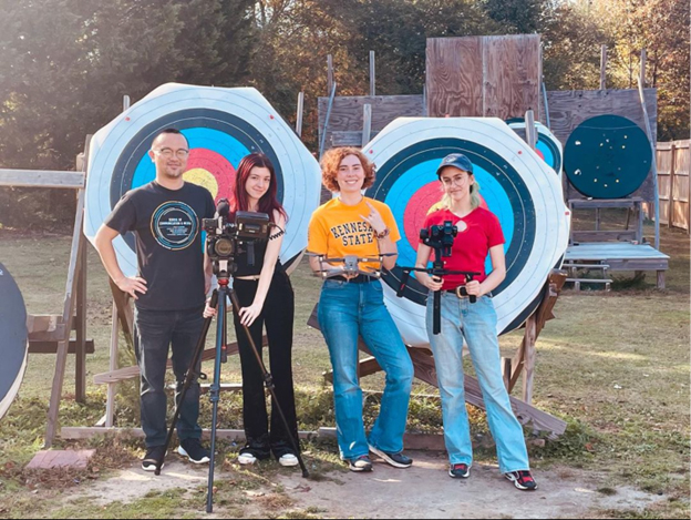 Sangsun Choi (left), poses with KSU students (left to right) Marisa Behan, Olivia Chaney, Nelly Koz
