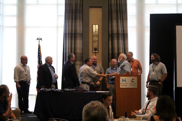 Daniel Branham at a podium, being elected to serve as a Director of the Surveying and Mapping Society of Georgia