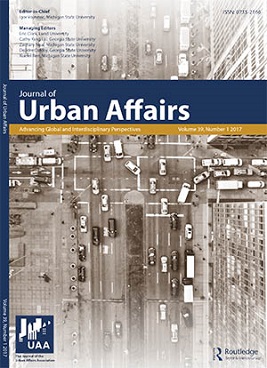 The cover of the Journal of Urban Affairs, with an aerial view of a street with vehicles on it.