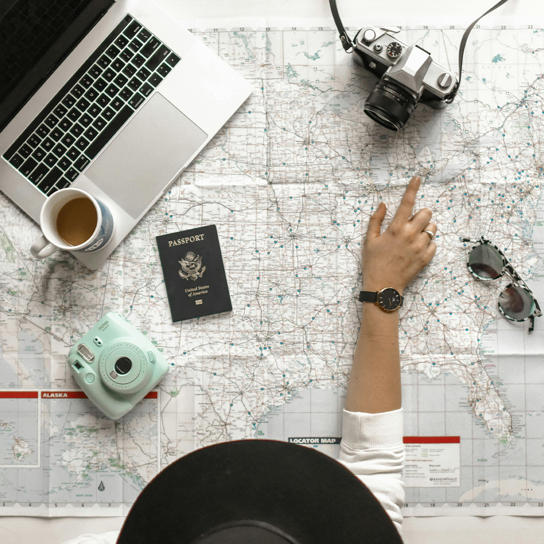 close up of person at a desk with a map