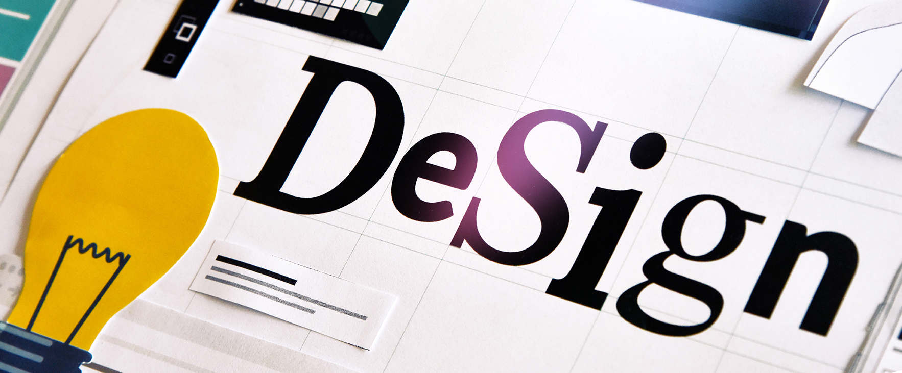 the word design next to a lightbulb