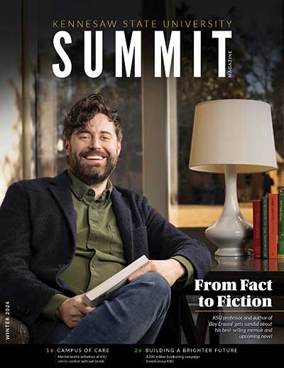 summit magazine with man smiling