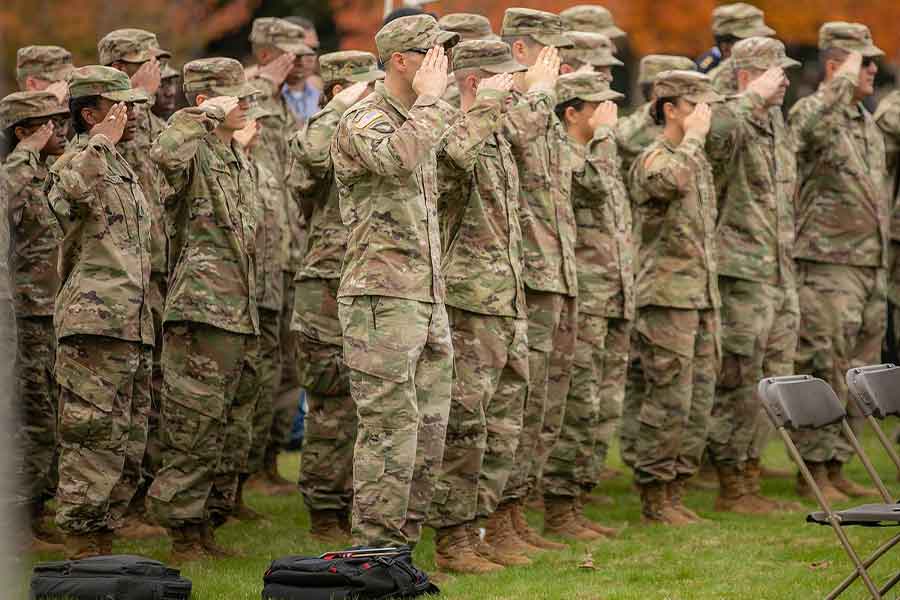 Group of veterans saluting.