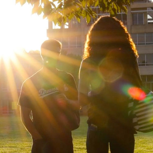 ksu students walking on campus in sunshine