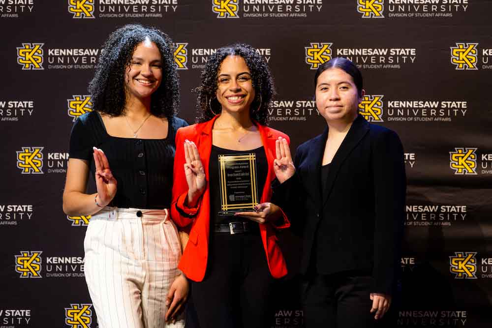 Lambda Upsilon Señoritas Latinas Unidas Sorority, Inc. posing with their award