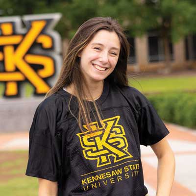 ksu student wearing official KSU t-shirt"