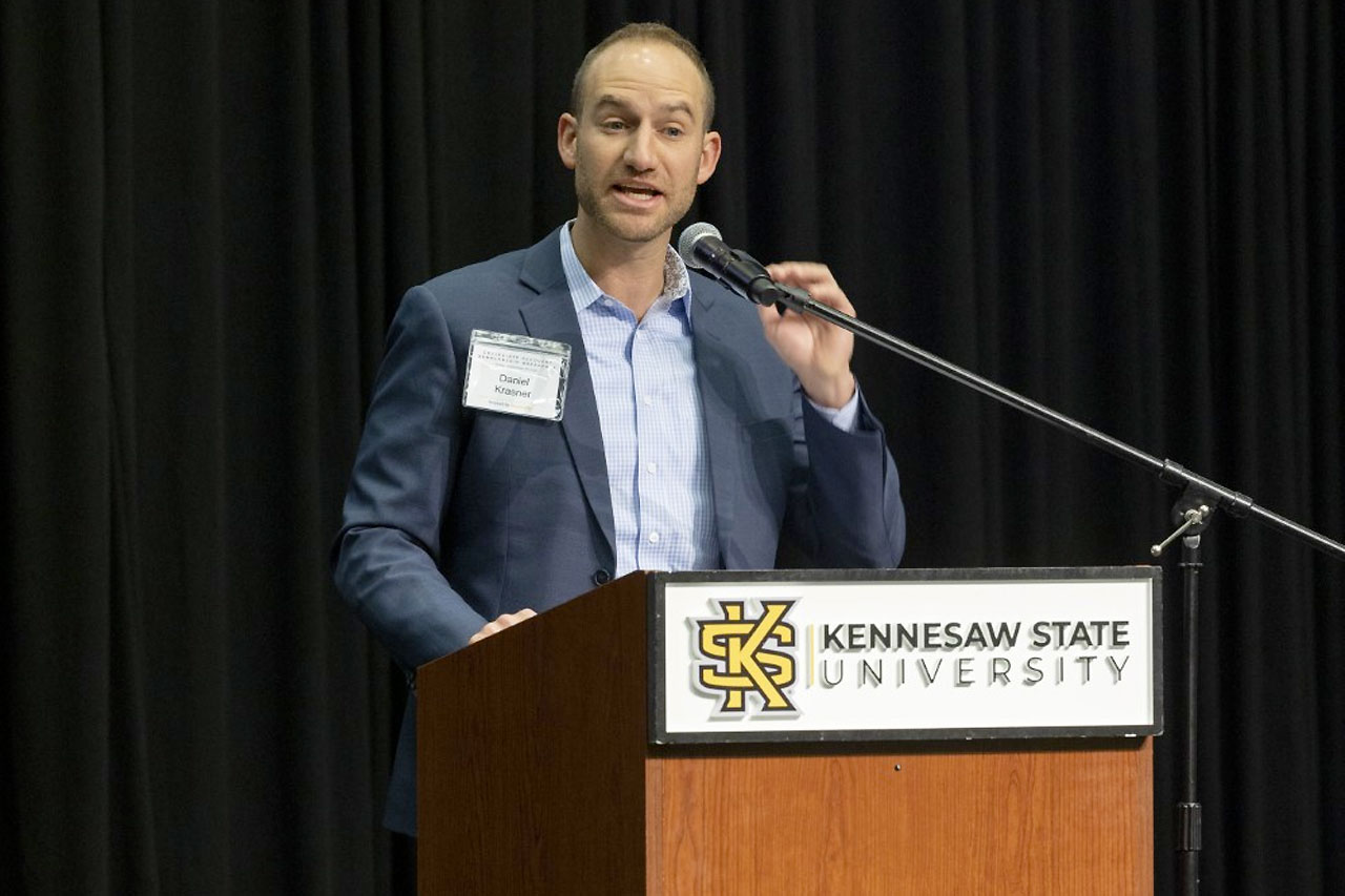 woman celebrating at Collegiate Recovery Scholarship Breakfast event