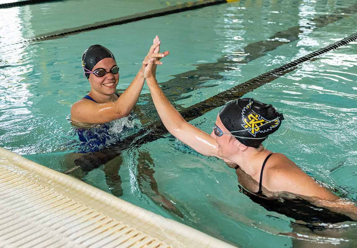 ksu students swimming in indoor pool together