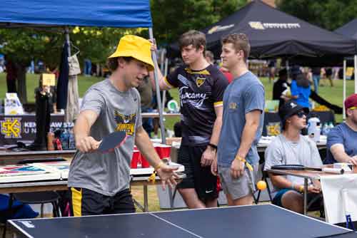 ksu club sport memebers playing table tennis\