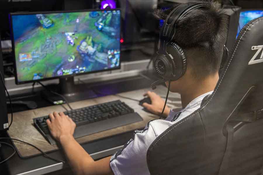 student playing video games on a computer
