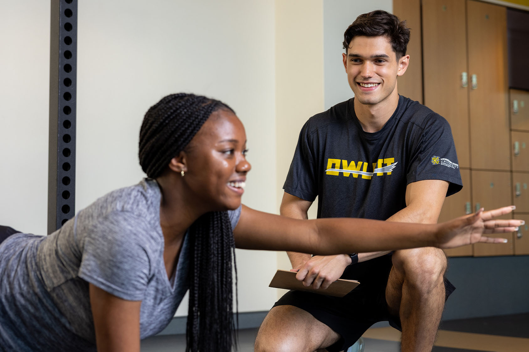 ksu students woprking out with a personal trainer