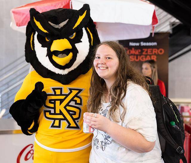 scrappy posing with KSU student