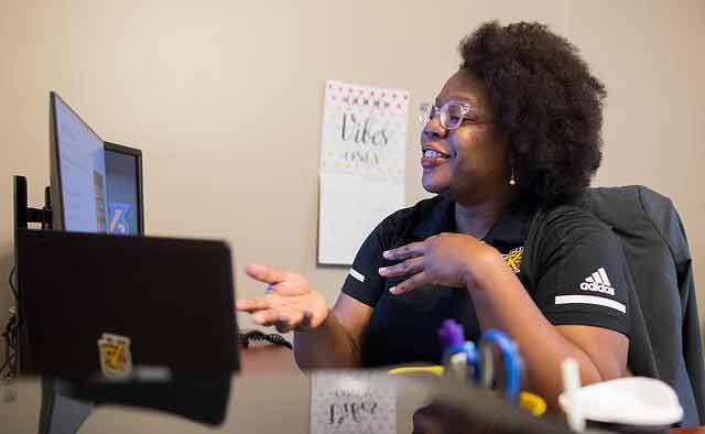 ksu employee conducting virtual meeting on laptop