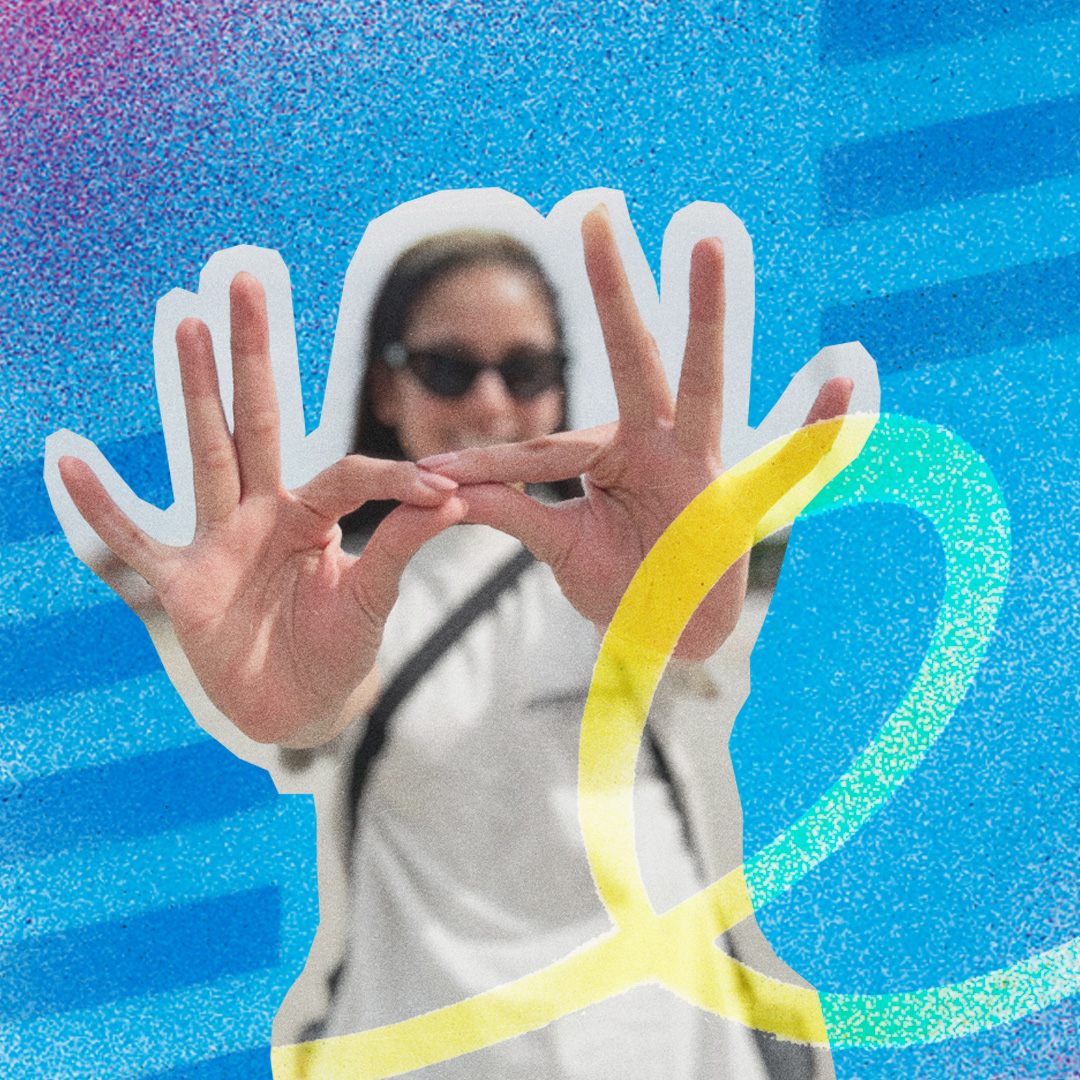 KSU student holds hands together forming Owl Eyes