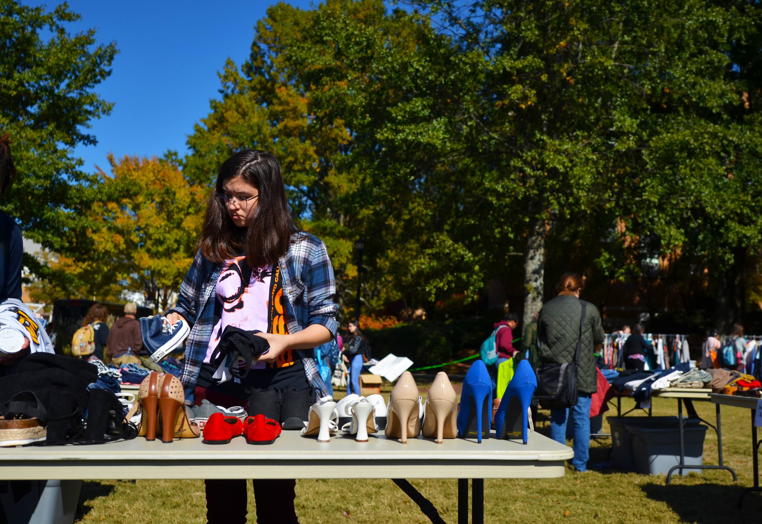 student at a clothing swap event