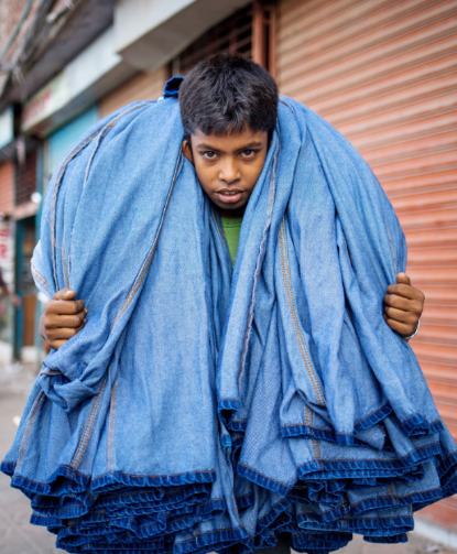 young boy garment worker