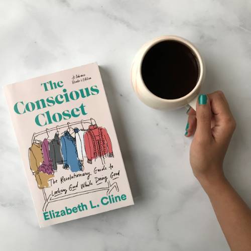 The conscious closet book on a coffee table.