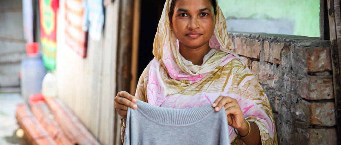 young worker holding sweater