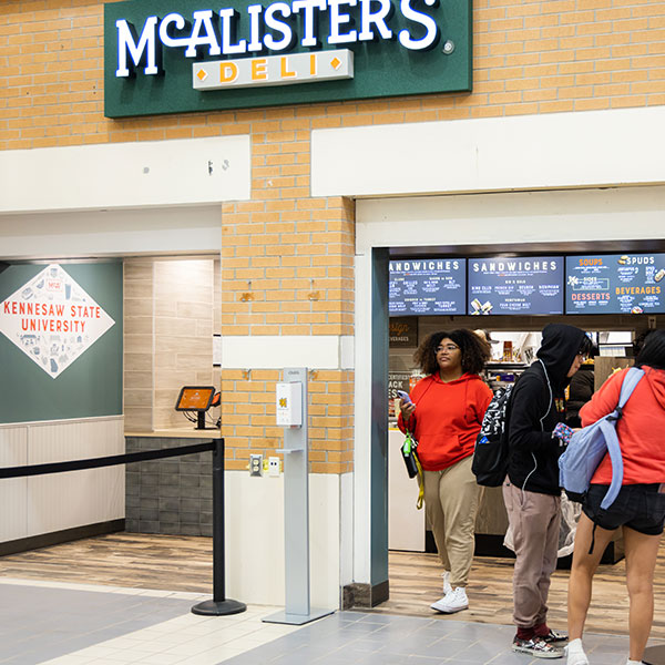 Students picking up their meal at McAlister's Deli
