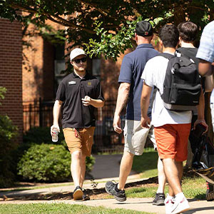 a group of people walking on campus