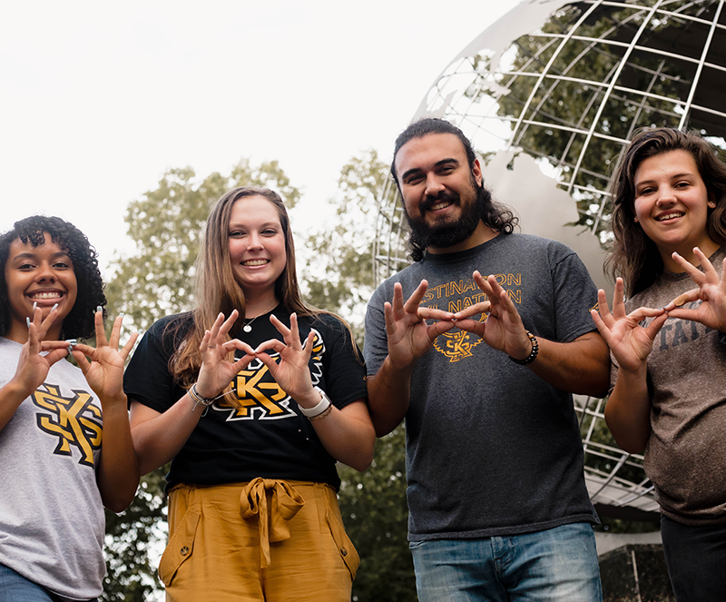 Tour guides showing the owl eyes symbols