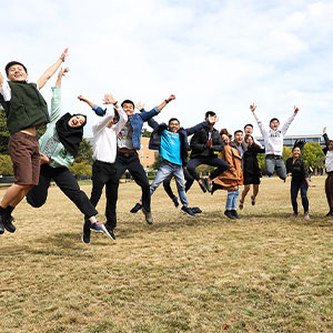 Jumping students on the KSU green