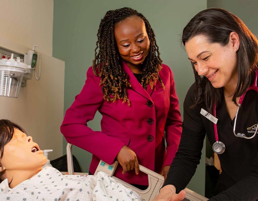 ksu part time faculty practicing on a test dummy.