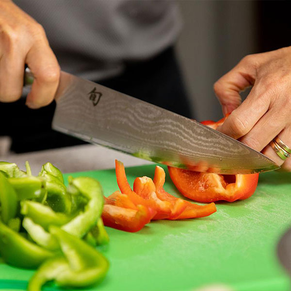ksu student chopping vegetables